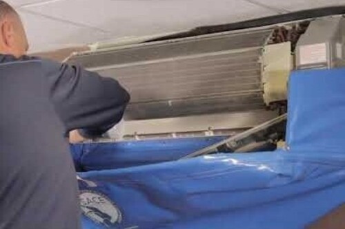 a ductless unit being cleaned