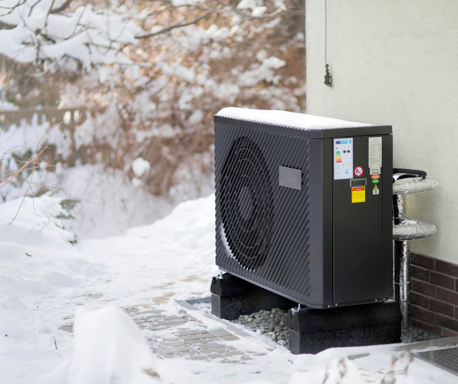 Heat Pump on side of house in winter